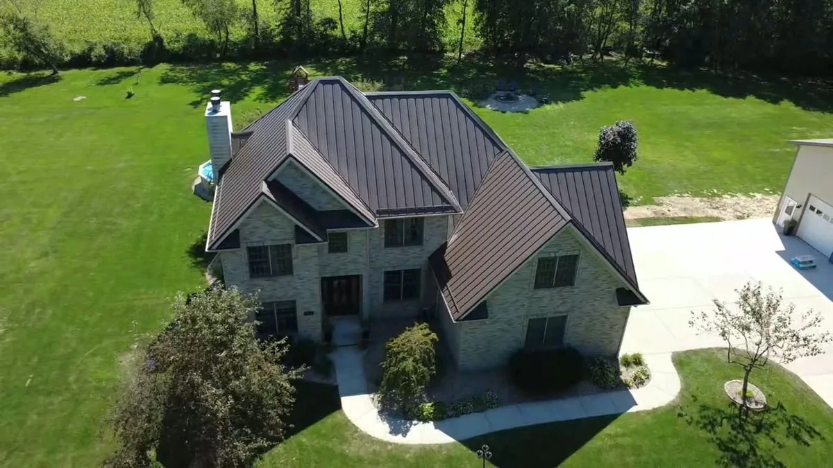 Aerial view of a completed metal roof installation